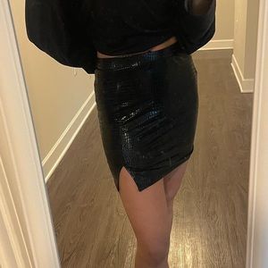 Black leather skirt with small side slit! Size medium but does fit a bit smaller